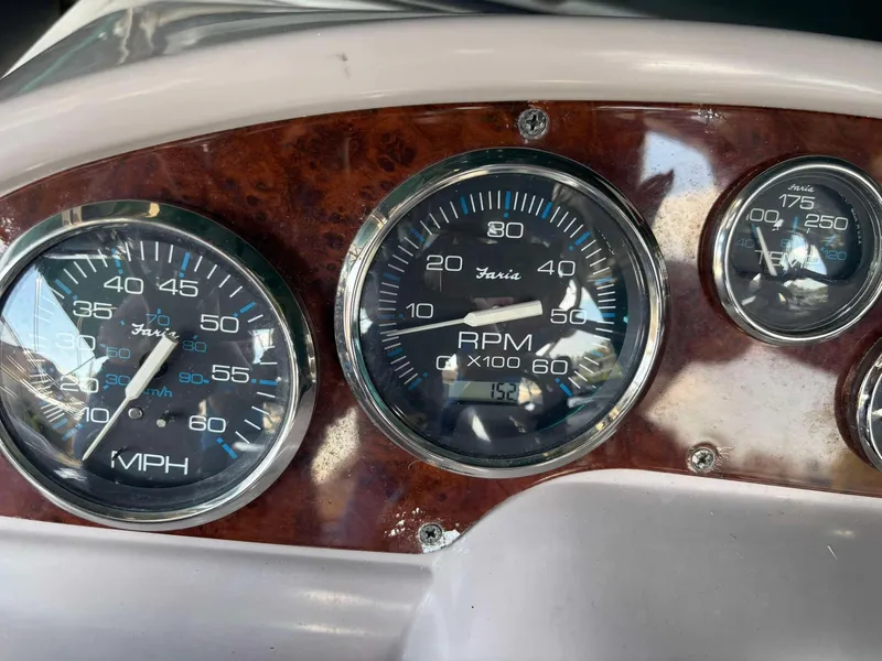Slide: The Image of Dashboard of a 2000 Regal 2800 LSR boat with speedometer and RPM gauges. - 14