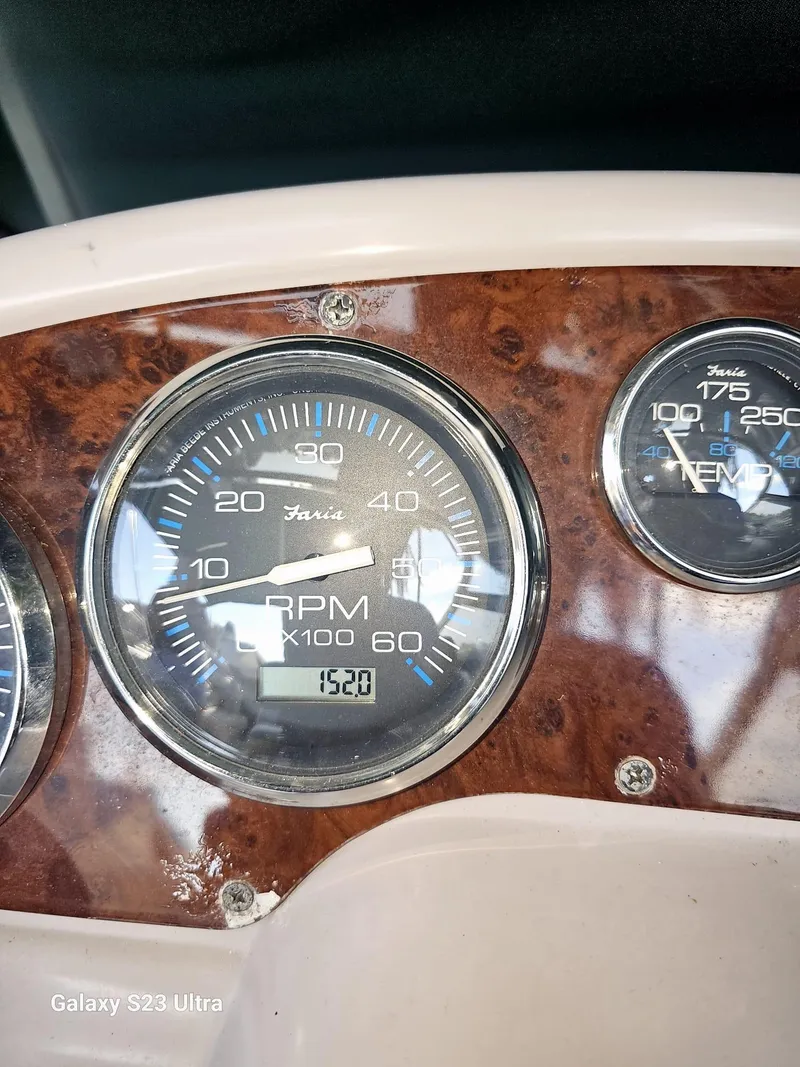 Slide: The Image of Close-up of 2000 Regal 2800 LSR boat dashboard with RPM and speed gauges. - 16