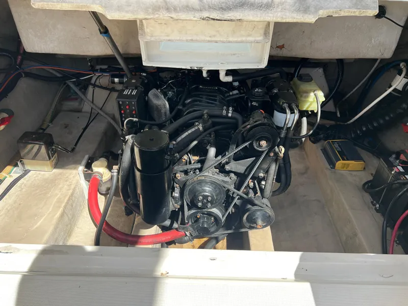 Slide: The Image of Engine compartment of a 2000 Regal 2800 LSR boat, showcasing mechanical components. - 18