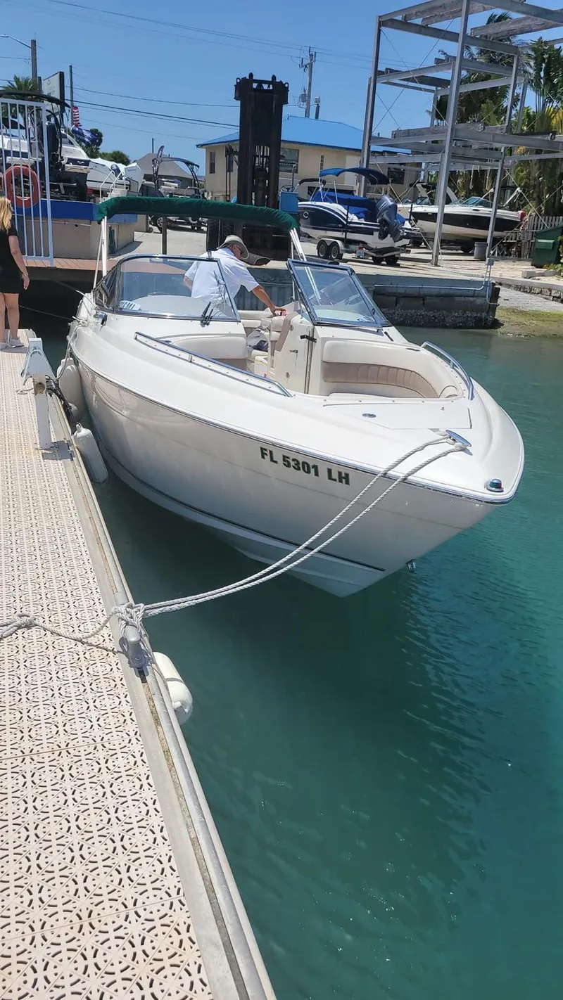 Slide: The Image of 2000 Regal 2800 LSR boat docked in sunny marina. - 20