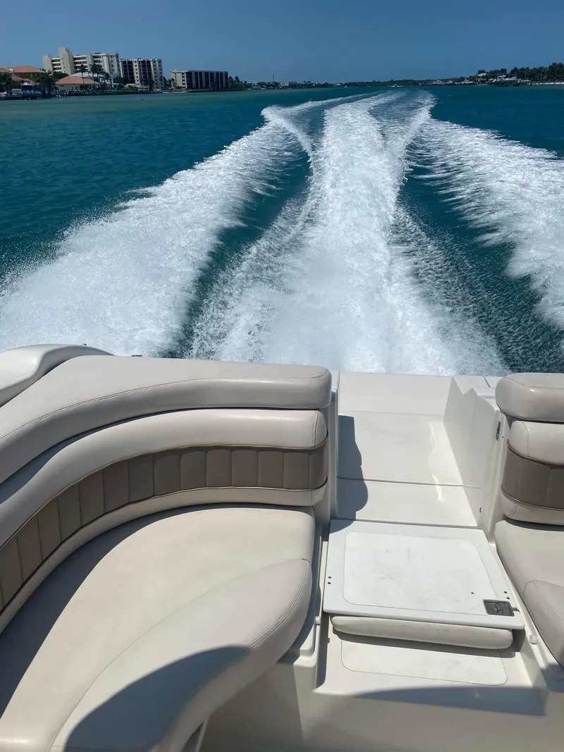 Slide: The Image of Regal 2800 LSR boat cruising on clear blue water, leaving a wake trail. - 8