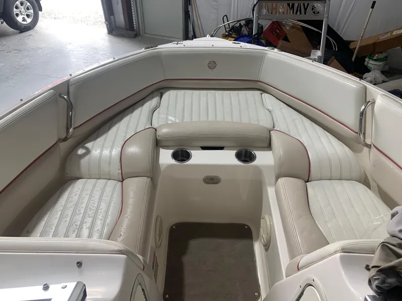 Slide: The Image of 2006 Bryant 206 BR boat interior with white seating and cup holders. - 15