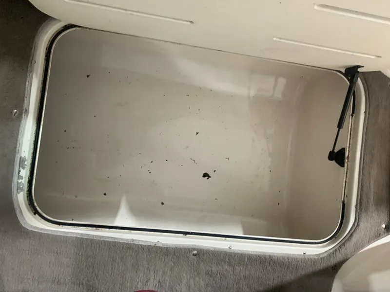 Slide: The Image of Open storage compartment in a 2006 Bryant 206 BR boat, showing interior space. - 24