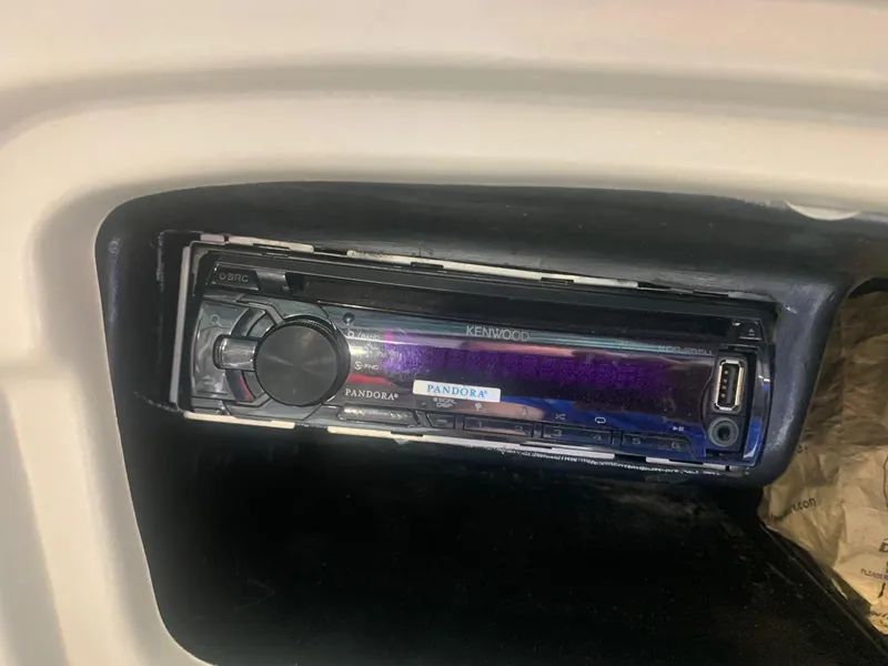 Slide: The Image of Kenwood stereo system in a 2006 Bryant 206 BR boat dashboard. - 42