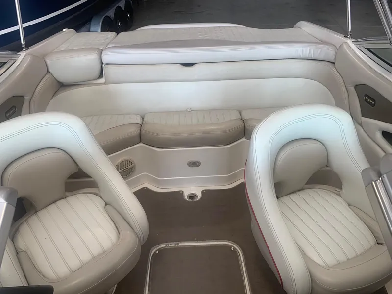 Slide: The Image of 2006 Bryant 206 BR boat interior with white leather seating and spacious layout. - 45