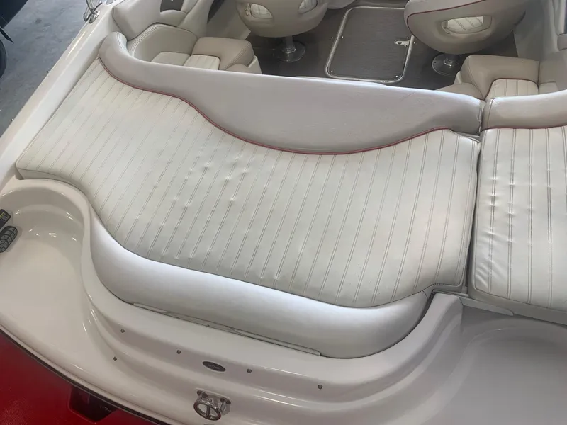 Slide: The Image of 2006 Bryant 206 BR boat interior with white cushioned seating. - 47