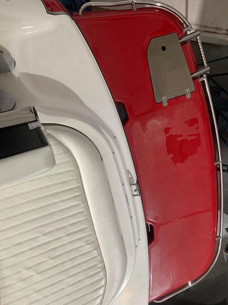 Slide: The Image of 2006 Bryant 206 BR boat interior with red and white seating. - 9