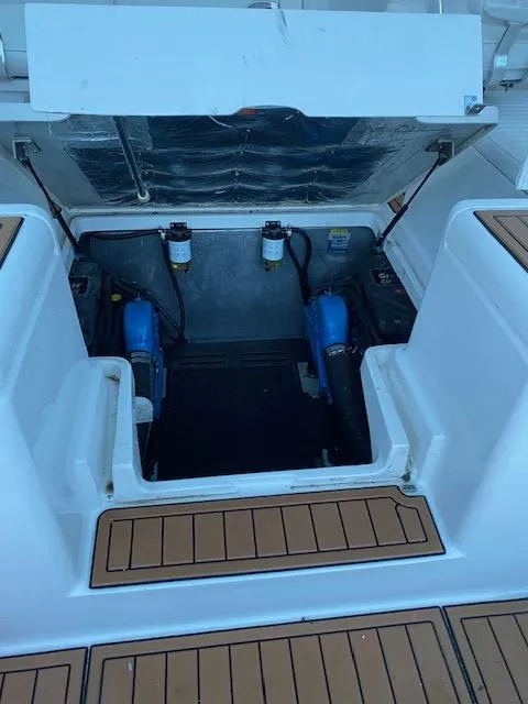 Slide: The Image of 2006 Luhrs 28 Open engine compartment with dual engines and clean layout. - 18