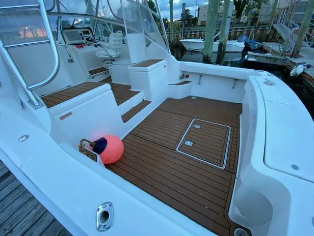 Slide: The Image of 2006 Luhrs 28 Open boat with teak deck, docked at marina. - 3