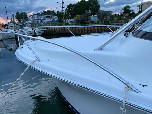 Slide: The Image of 2006 Luhrs 28 Open boat docked at marina during sunset. - 5