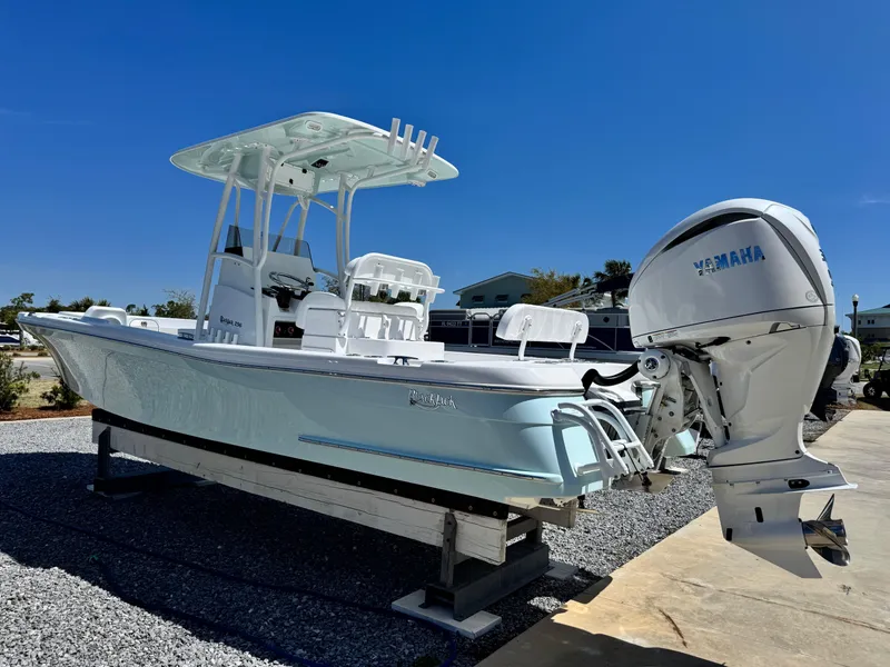 Slide: The Image of 2025 BlackJack 256 Coastal boat with Yamaha engine on display outdoors. - 5