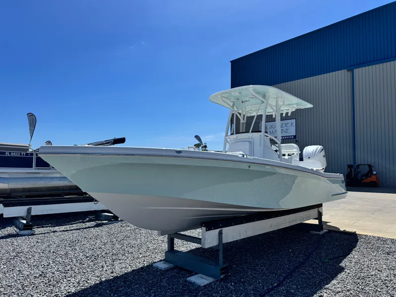 Slide: The Image of 2025 BlackJack 256 Coastal boat displayed outdoors on a sunny day. - 6