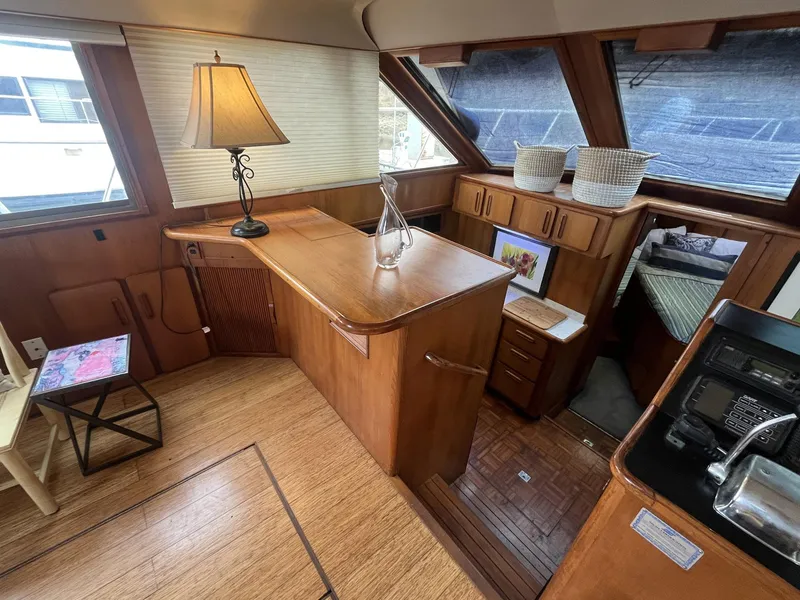 Slide: The Image of Interior of 1987 Jefferson 42 SE Sundeck Motor Yacht with wood finish and cozy decor. - 20