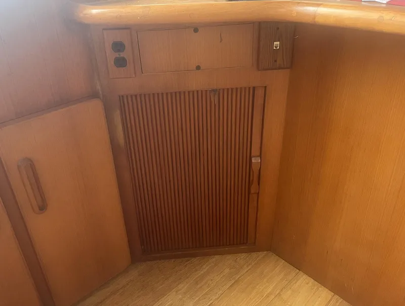 Slide: The Image of 1987 Jefferson 42 SE Sundeck Motor Yacht interior with wooden cabinetry and paneling. - 23