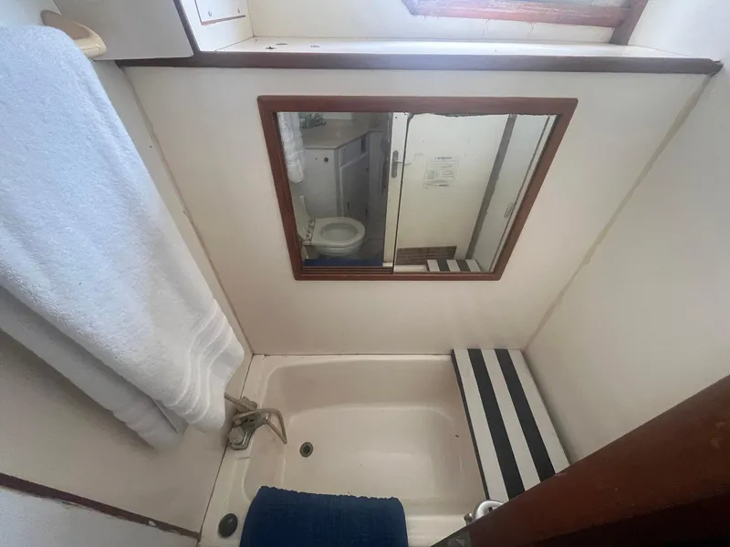 Slide: The Image of Bathroom interior of 1987 Jefferson 42 SE Sundeck Motor Yacht with mirror and towel. - 41