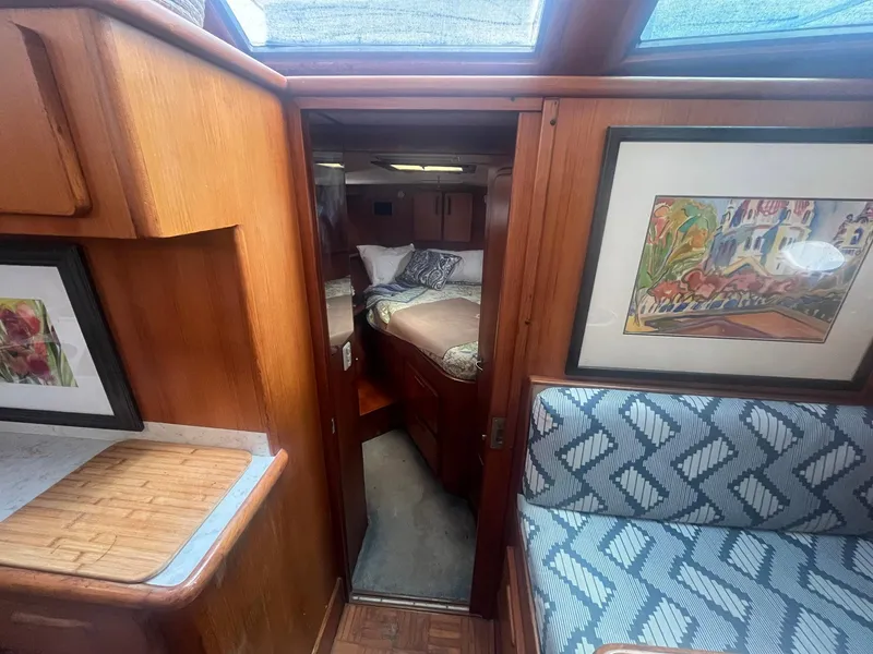 Slide: The Image of Interior of 1987 Jefferson 42 SE Sundeck Motor Yacht with cozy cabin and artwork. - 43
