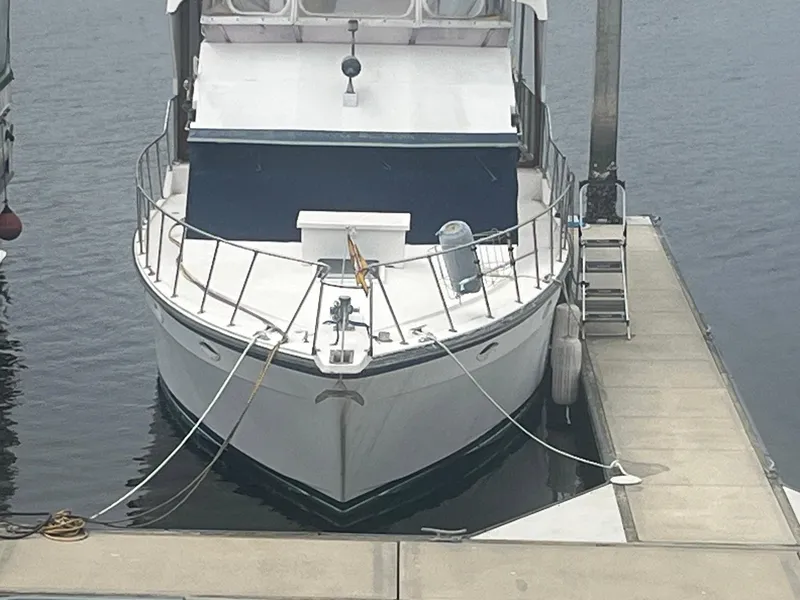 Slide: The Image of 1987 Jefferson 42 SE Sundeck Motor Yacht docked at marina. - 8