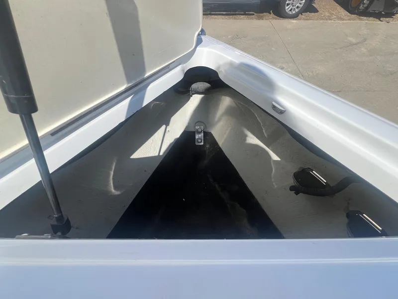 Slide: The Image of Open storage compartment of a 2007 Cobalt 232 boat, showing interior details. - 10