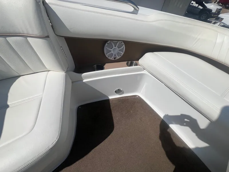 Slide: The Image of 2007 Cobalt 232 boat interior with white seating and speaker. - 13