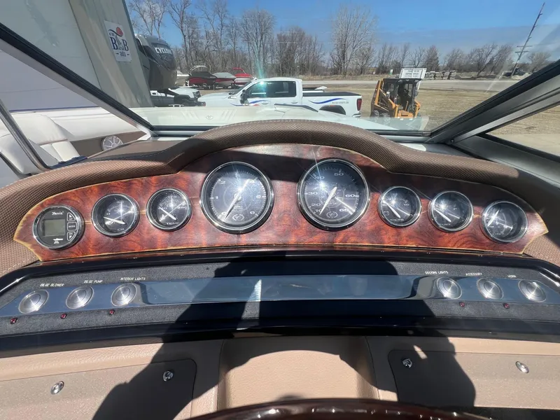 Slide: The Image of Dashboard of a 2007 Cobalt 232 boat with multiple gauges and controls. - 15