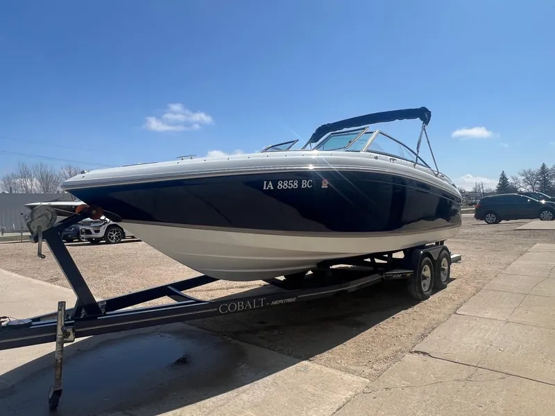 Slide: The Image of 2007 Cobalt 232 boat on trailer under clear blue sky. - 2