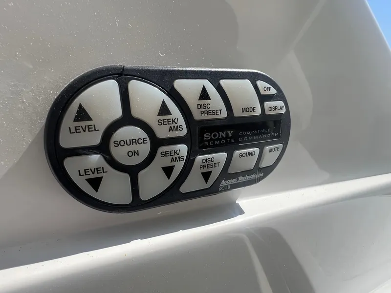 Slide: The Image of Sony remote commander on 2007 Cobalt 232 boat, featuring various control buttons. - 33