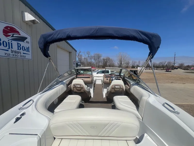 Slide: The Image of 2007 Cobalt 232 boat interior with seating and canopy, displayed at Boji Boat Brokers. - 8