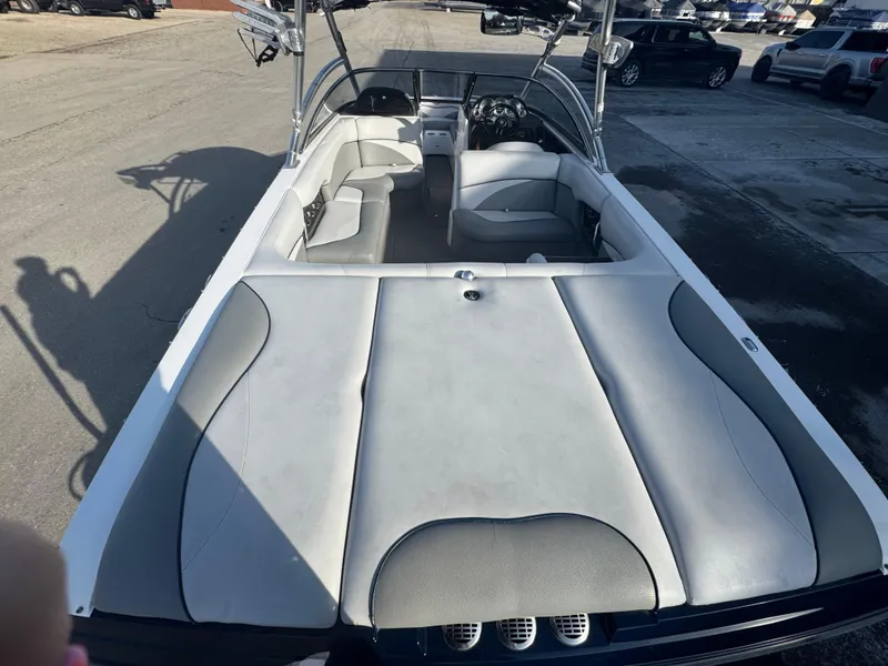 Slide: The Image of 2007 Supra 22SSV boat interior with gray seating and open deck layout. - 11