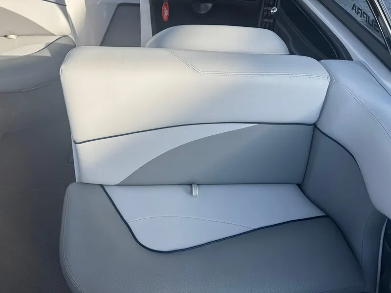 Slide: The Image of 2007 Supra 22SSV boat interior with gray and white seating. - 16