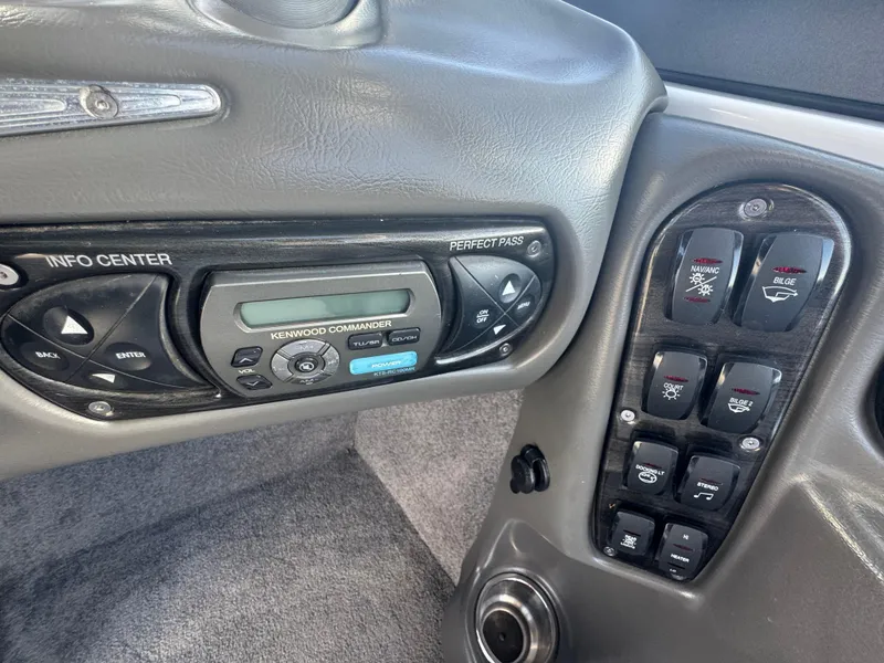 Slide: The Image of 2007 Supra 22SSV dashboard controls with Kenwood Commander and various switches. - 19