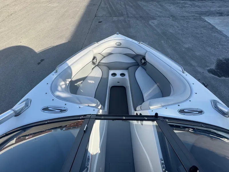 Slide: The Image of 2007 Supra 22SSV boat interior with gray seating and cup holders. - 20