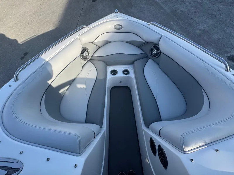Slide: The Image of 2007 Supra 22SSV boat interior with gray seating and cup holders. - 21