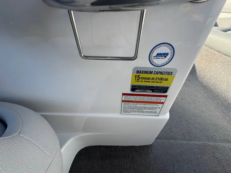 Slide: The Image of 2007 Supra 22SSV boat capacity label, maximum 15 persons or 2100 lbs. - 22