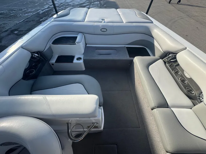 Slide: The Image of 2007 Supra 22SSV boat interior with gray seating and cup holders. - 7