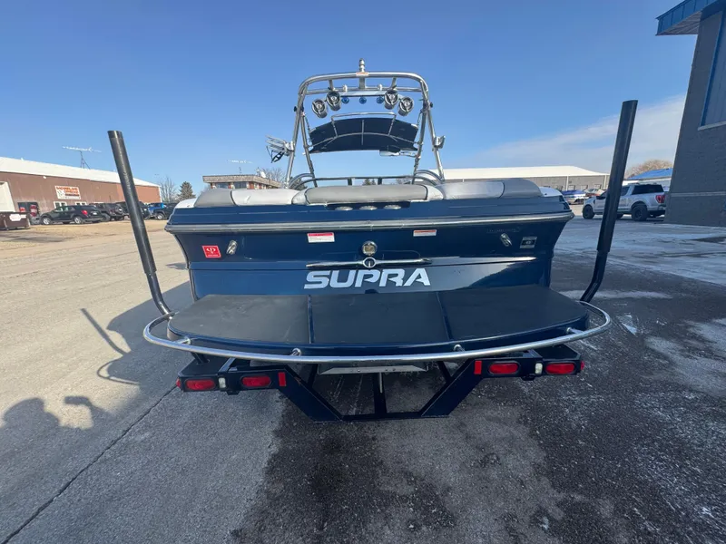 Slide: The Image of 2007 Supra 22SSV boat rear view in a parking lot. - 8