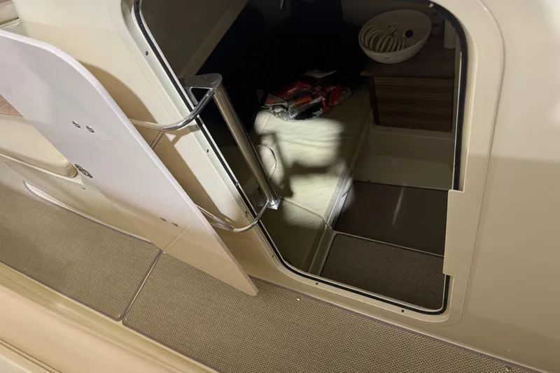 Slide: The Image of 2018 Chris-Craft Catalina 30 CL cabin entrance with open door and interior view. - 19
