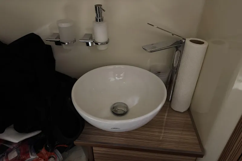 Slide: The Image of Modern bathroom sink with faucet and accessories on Chris-Craft Catalina 30 CL, 2018 model. - 20