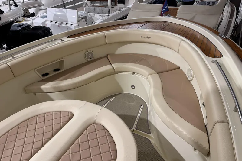Slide: The Image of 2018 Chris-Craft Catalina 30 CL boat interior with elegant seating and wood accents. - 26