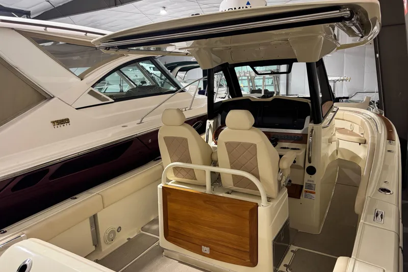 Slide: The Image of 2018 Chris-Craft Catalina 30 CL boat interior with dual seats and helm station. - 27