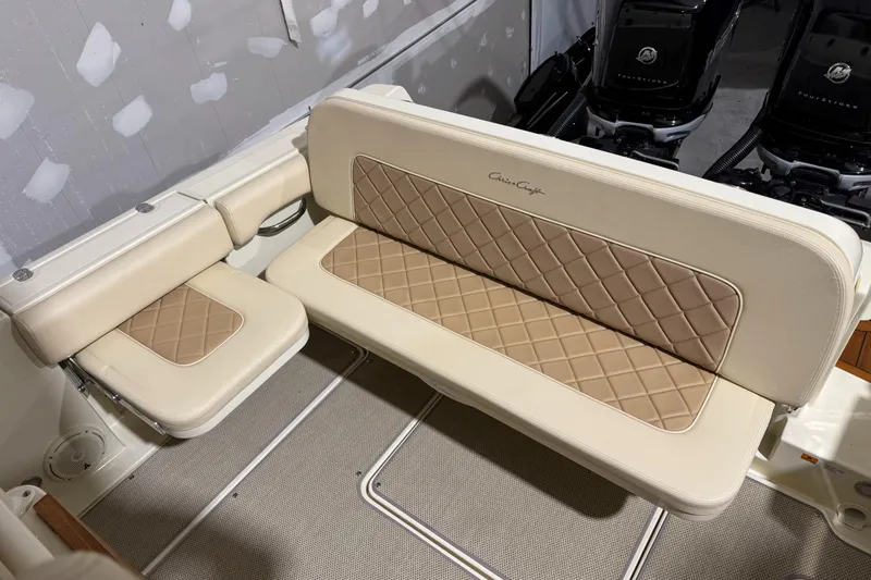Slide: The Image of 2018 Chris-Craft Catalina 30 CL boat seating with beige and tan diamond-patterned upholstery. - 32