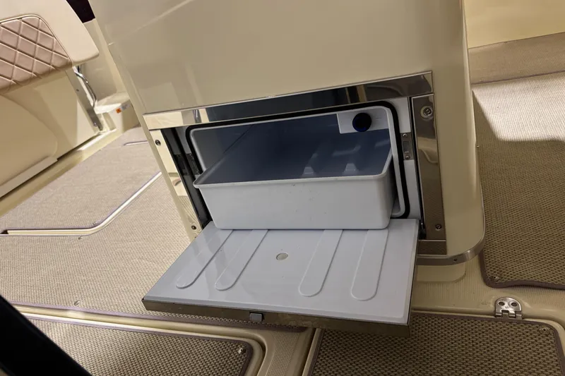 Slide: The Image of 2018 Chris-Craft Catalina 30 CL boat interior with open storage compartment. - 34