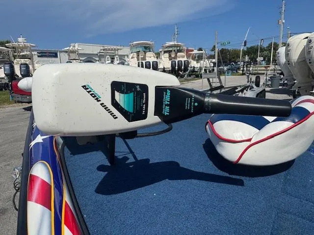 Slide: The Image of Trolling motor on a 2006 Storm Boats 22, displayed in a boat dealership. - 11