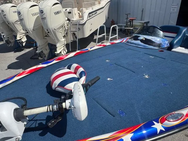 Slide: The Image of 2006 Storm Boats 22 with patriotic design, featuring Yamaha outboard motors in a marina setting. - 12