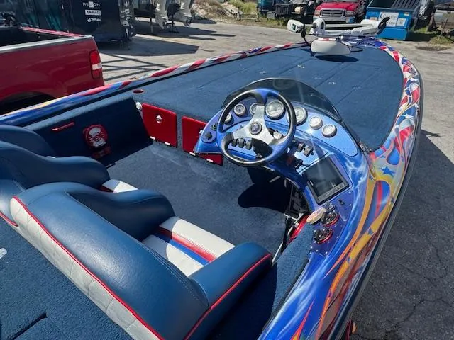 Slide: The Image of 2006 Storm Boats 22 with vibrant interior and modern dashboard design. - 6