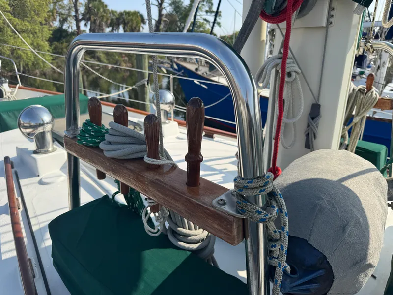Slide: The Image of 1989 Hans Christian 43T sailboat deck with ropes and polished metal fittings. - 11
