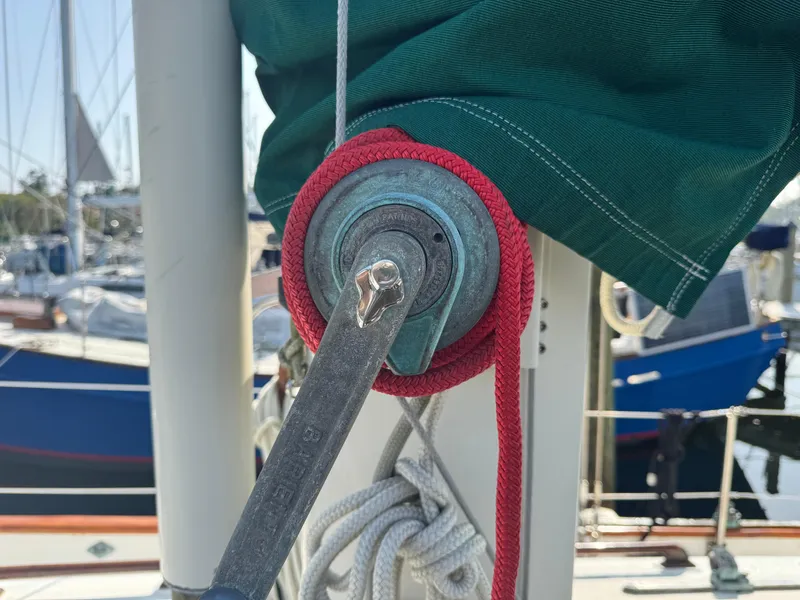 Slide: The Image of Close-up of a winch on a 1989 Hans Christian 43T sailboat with red rope. - 12
