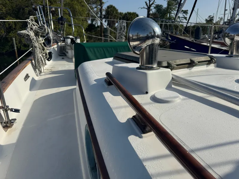 Slide: The Image of Deck view of 1989 Hans Christian 43T sailboat with polished fittings and rigging. - 13
