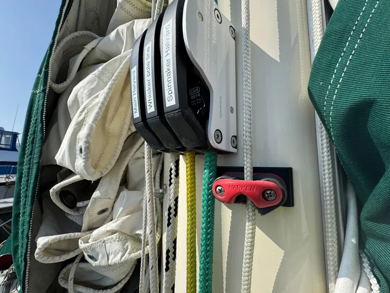 Slide: The Image of Close-up of sailboat rigging on a 1989 Hans Christian 43T, featuring ropes and sail details. - 25