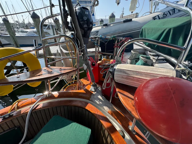 Slide: The Image of Cockpit of 1989 Hans Christian 43T sailboat with nautical equipment and lifebuoy. - 28