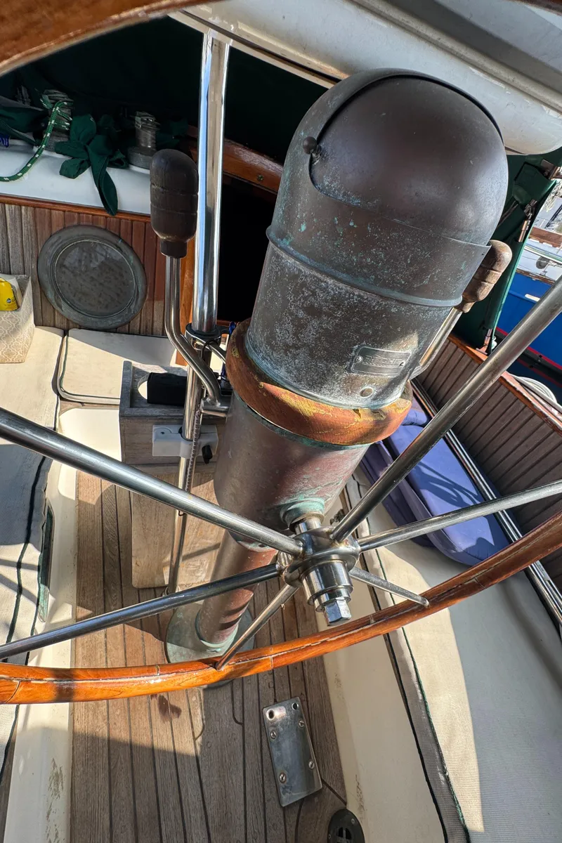 Slide: The Image of Steering wheel of 1989 Hans Christian 43T sailboat, showcasing vintage nautical design. - 32